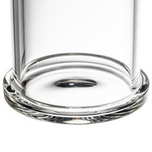 Close-up view of the clear, rounded base of the MJ Arsenal Piston Gravity Bong, a cylindrical borosilicate glass piece, shown against a white background.
