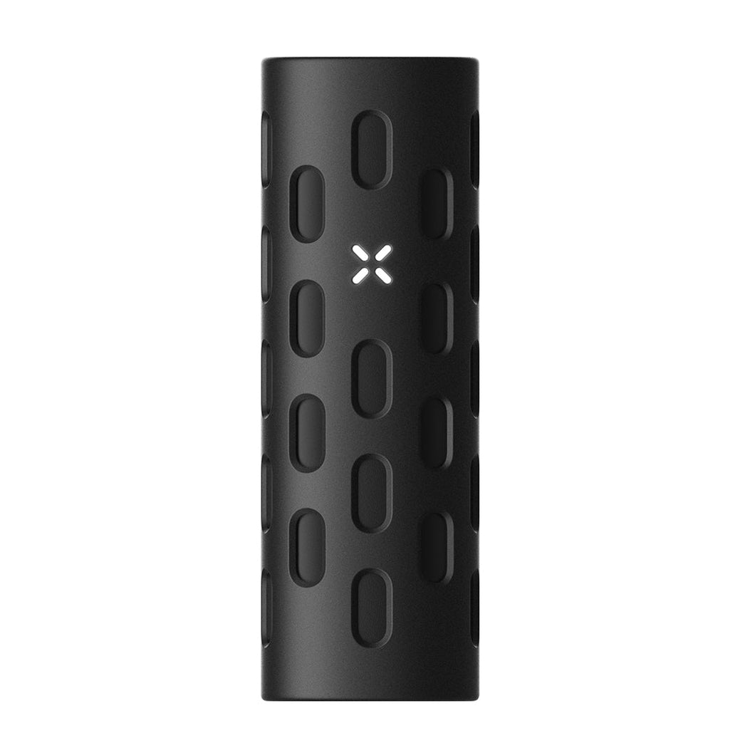 The PAX Flow Vaporizer with Grip Sleeve Bundle features a black cylindrical design with an oval pattern, a white illuminated X in the center, and a textured modern surface, showcasing innovative hybrid heating technology.