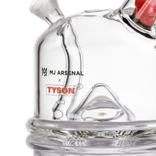 Close-up of the MJ Arsenal x Tyson 2.0 Punch-Out, a clear borosilicate glass cone bubbler featuring printed MJ Arsenal and Tyson 2.0 logos on its smooth, rounded surface with visible joints.
