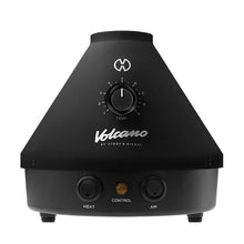 The Storz & Bickel Volcano Classic is a black, cone-shaped German vaporizer with convection heating, a temperature control dial, and three front buttons: Heat, Control, and Air.