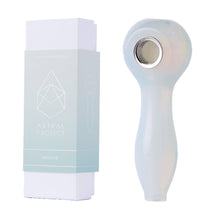 A translucent Gemstone Spoon Pipe with a rounded opalite glass bowl sits beside its light blue and white Astral Project – Opalite box, which features a bold geometric design.