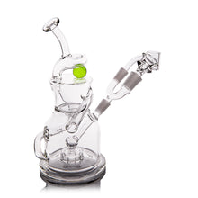 The MJ Arsenal The iLL-ien Dab Rig is a clear glass rig with a twisted design, green spinning marble top accent, and attached filtration parts, all displayed against a white background.