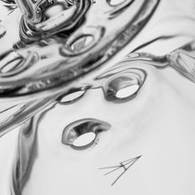 Close-up of a clear, reflective surface with round holes and abstract swirling patterns, light and shadows playing across it—much like the MJ Arsenal Bloopcycler Dab Rig elevates dabbing with its artistic design and glossy finish.