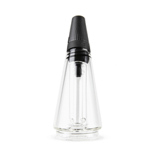 The Puffco Peak Travel Glass is a clear, conical bottle with a black ribbed screw-on cap and applicator wand, shown upright on a white background—ideal for use with your Puffco Peak Pro.