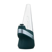 The New Peak Vaporizer is a modern, sleek device featuring a black base, silver accents, and a clear 3D Chamber on top, standing upright against a white background.