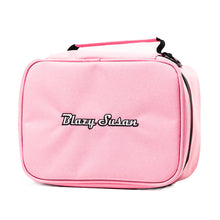 The Blazy Susan Stash Bag is a light pink, rectangular bag with a black zipper, front embroidered logo, top handle, and rolling tray compatibility for stylish, organized storage.