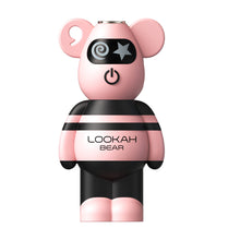 The Lookah Bear 510 Thread Battery is a pink and black, bear-shaped device with cartoon features—swirl and star eyes plus an on/off power symbol—compatible with 510 tanks and labeled LOOKAH BEAR.