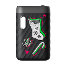 The black, ridged CCELL Sandwave vape is decorated with festive stickers like a Christmas stocking, candy cane, cannabis leaves, and a red bell, and it features convenient Type-C charging.