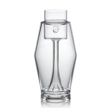 The MJ Arsenal Proxy Bubbler features a clear borosilicate glass body with a modern, angular design, integrated strainer, and stands upright against a white background.