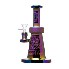 The Human Grade Aztec (Sandblasted) Glass Water Pipe features colorful, iridescent tribal-style etching, a wide base, cylindrical neck, clear glass bowl attachment, and is handmade from durable borosilicate glass.