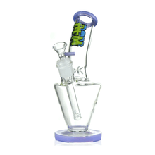 The AFM Glass 9" Upside Down Glass Beaker is a clear borosilicate water pipe with purple accents, a tilted neck, and a colorful AMG graffiti-style logo on the neck. Comes with a 14mm downstem for smooth, reliable hits.