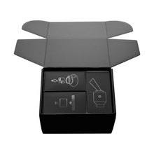 The Softglass Tandem Rig Kit features a black box with its lid open, showing neatly arranged compartments labeled with white line drawings for each included electronic component.