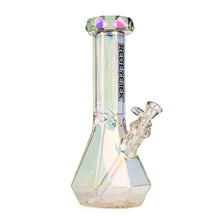 The Red Eye Tek 12" Orion Beaker Base Glass Water Pipe features faceted, iridescent 14mm borosilicate glass, a flared mouthpiece, angled downstem, and bowl. The RED EYETECK label is printed vertically on the neck.