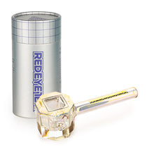 The Red Eye Tek 4.5" Infinity Bowl (Octagon), a clear borosilicate glass pipe with a faceted bowl and REDEYE TEK branding, sits beside a cylindrical silver container featuring the matching logo and grid pattern.