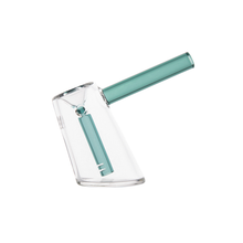 The MJ Arsenal Fulcrum Bubbler is a clear, borosilicate glass mini bubbler with a teal mouthpiece and internal teal downstem, featuring a modern angled design. It is shown on a white background.