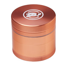 The BIGFUN! Medium Grinder is metallic orange aluminum with a textured grip and a white stylized logo on top, shown against a white background.