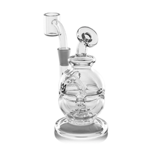 The MJ Arsenal Royale Mini Dab Rig is crafted from durable borosilicate glass and features a fab egg percolator, curved neck, circular base, side-mounted quartz banger, and a decorative top handle.