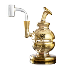 The MJ Arsenal Royale Mini Dab Rig, made from durable gold-tinted borosilicate glass, showcases a round base, curved neck, side mouthpiece, quartz banger attachment, decorative logo, and detailed glasswork.