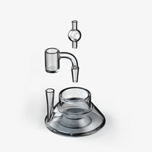 A minimalist photo presents the SOFTGLASS TANDEM BASE KIT disassembled into three clear glass parts—spout, body, and base—floating against a white background.