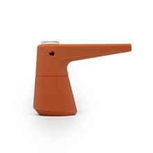 The SOFTGLASS PIER BUBBLER is a modern, orange, cone-shaped silicone water pipe with a long spout and a small borosilicate glass top section, featuring a minimalist geometric design against a white background.