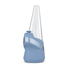 The New Peak Vaporizer is a modern, blue and silver device with a 3D chamber and conical glass top, inspired by the Puffco New Peak, shown from the side against a white background.
