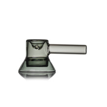 The MJ Arsenal Grotto Glass Pipe features modern, translucent gray borosilicate glass with a wide flat base, cylindrical side handle, and minimalist mug-like or beaker-inspired look complete with a spout.