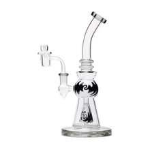 The Human Grade 10" Mini Gumball Rig Glass Water Pipe features clear borosilicate glass, a curved neck, a central round black design, a side bowl attachment, and sits on a wide base.