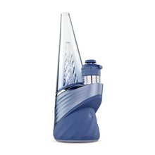 The Puffco New Peak Pro with 3D XL Chamber, a modern smart rig vaporizer in blue and clear with a spiral glass chamber and cylindrical mouthpiece, stands upright against a white background.