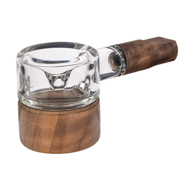 Glass smoking device with wooden handle and base on a white background