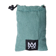 The MJ Arsenal Padded Drawstring Pouch is a small teal, ribbed bag for glass accessory storage, featuring a black patch with a white geometric logo on the front.