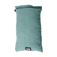 The MJ Arsenal Padded Drawstring Pouch features teal corduroy, a folded top, and a black and white logo patch—ideal for stylishly storing glass accessories. Photographed against a white background.