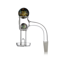 The MJ Arsenal Full Weld Quartz Terp Slurper is a clear glass dab rig attachment with a curved neck, flat-bottomed bowl, and round carb cap with colorful designs—perfect for use with quartz bangers or MJ Arsenal Mini Rigs.
