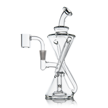 The MJ Arsenal Time Turner Mini Dab Rig is a clear borosilicate glass recycler with an hourglass shape, angled tubes, and a side chamber. It features a modern design and sits securely on a flat base.