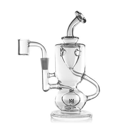 The MJ Arsenal Titan Mini Dab Rig is a clear borosilicate glass rig with an intricate design, multiple chambers, a curved neck, and an angled mouthpiece, shown against a white background.