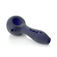 The Grav Sandblasted Spoon is a dark blue pipe with a matte finish, rounded deep bowl, and straight stem. "GRAV" is embossed on the side. It’s photographed against a white background.