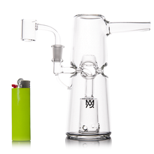 The MJ Arsenal Turret Mini Dab Rig, crafted from durable borosilicate glass with a side mouthpiece and percolator, stands upright beside a bright green lighter for size reference on a white background. Ideal for portable dabbing.