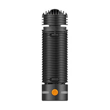 A black, cylindrical Storz & Bickel Crafty+ Vaporizer USB-C Charger with ridged sides, a vented top, and an orange power button sits on a white background—offering sleek portability and modern convenience.