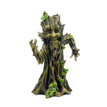 The Fantasy Tower Incense Burner is a whimsical, hand-painted resin tree stump figurine with a face, extended branch arms, and green ivy leaves climbing its trunk, set against a white background.