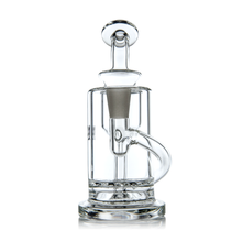 The MJ Arsenal Ursa Mini Dab Rig features clear borosilicate glass, a cylindrical chamber, round base, angled mouthpiece, and accessory joint—shown here against a white background.