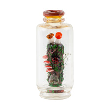 The Empire Glass Works Renew the Redwood Peak Top is a clear borosilicate glass bottle featuring a miniature forest theme with mushrooms, ladybugs, moss on a log, and whimsical details inside.