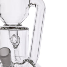 Close-up of the MJ Arsenal Alpine Series - Apex Mini Rig, showcasing its clear glass, curved and straight tubes, smooth joints, detailed craftsmanship, and double uptake recycler design.