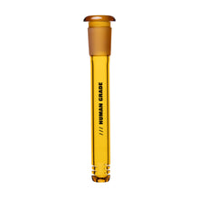 A tall, transparent amber Human Grade Color Downstem (14MM) with a rounded stopper, "HUMAN GRADE" printed vertically, optimal airflow, and three small base notches. It resembles a water pipe downstem. Background is white.