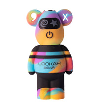 The Lookah Bear 510 Thread Battery is a multicolored, bear-shaped figurine with a black visor, swirl and star designs on its eyes, an X on one ear, a built-in 500mAh battery, and support for versatile 510 tanks.