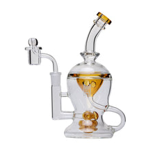The Human Grade The Nuke Glass Rig is a clear borosilicate glass dab rig with gold accents, a bent neck, side-mounted bowl, and an intricate mushroom cloud perc for smooth hits.