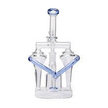 The Dualing Recycler Glass Rig Water Pipe, made from clear borosilicate glass with symmetrical blue accents and dual chambers, features a dual uptake recycler design for smooth filtration, shown against a plain white background.