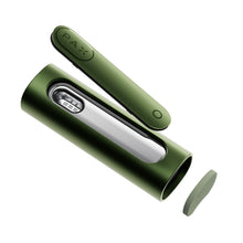 The PAX Flow Vaporizer with Grip Sleeve Bundle, a green, modern cylindrical dry herb device featuring a removable lid and sleek metallic interior, is shown disassembled on a white background with "PAX Flow" labeled on one piece.