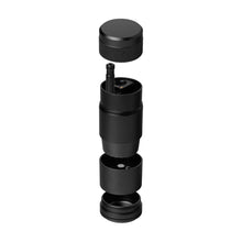 An exploded view of a black MJ Arsenal Capsule Grinder Dugout, a portable herb grinder with four vertically aligned parts—lid, handle, grinding chamber, and container—set against a white background.