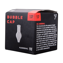 A black box labeled MJ Arsenal Carb Caps features a simple white spinner carb cap outline, red accents, and product details from MJ Arsenal, highlighting its directional airflow design.