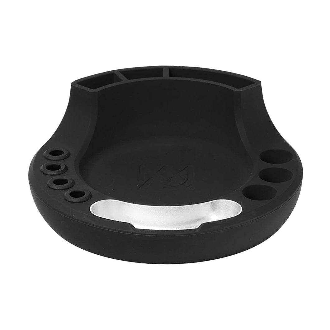 The MJ Arsenal Space Station is a black silicone organizer and session hub with round and rectangular compartments, plus a metallic silver front plate—ideal for holding small office supplies, tools, or as a glass accessory organizer.