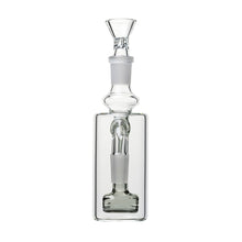 A clear glass 14mm DK Barrel Ash Catcher (45° or 90°) features a square base, cylindrical neck, glass stopper, and an internal barrel-shaped structure visible through the transparent sides.